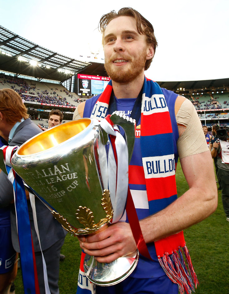 AFL 2016 Toyota AFL Grand Final - Sydney v Western Bulldogs MELBOURNE, AUSTRALIA - OCTOBER 01: Jordan Roughead of the Bulldogs holds the cup during the 2016 Toyota AFL Grand Final match between the Sydney Swans and the Western Bulldogs at the Melbourne Cricket Ground on October 01, 2016 in Melbourne, Australia. (Photo by Adam Trafford/AFL Media)